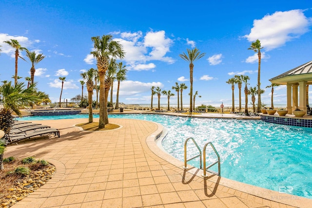 view of swimming pool featuring a patio area