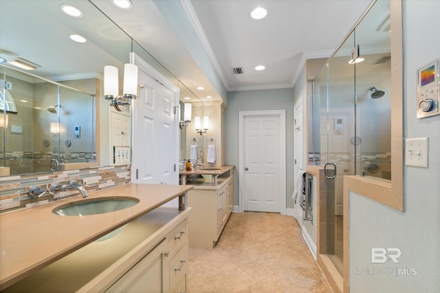 bathroom featuring ornamental molding, vanity, tile patterned floors, and a shower with shower door