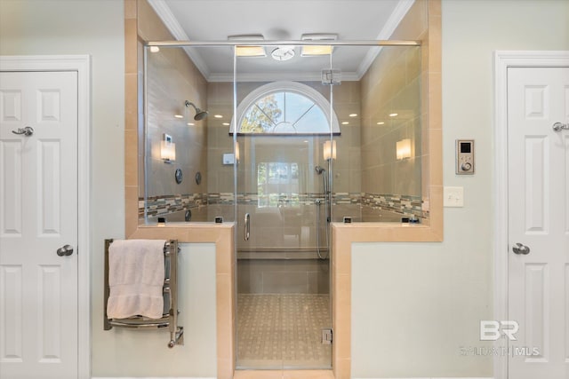 bathroom with tile patterned flooring, an enclosed shower, and ornamental molding