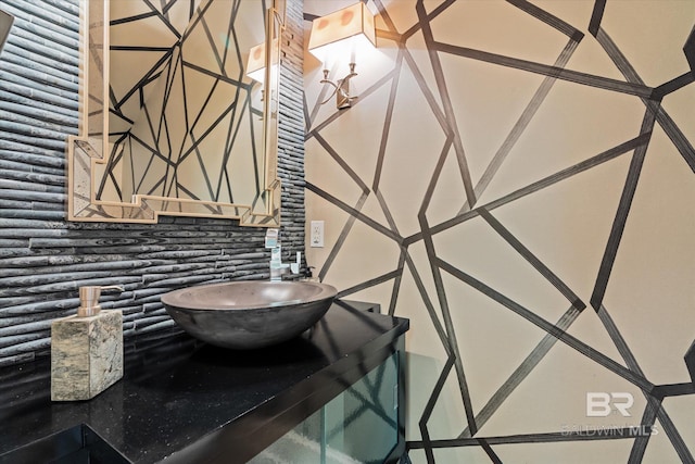 bathroom featuring decorative backsplash and sink