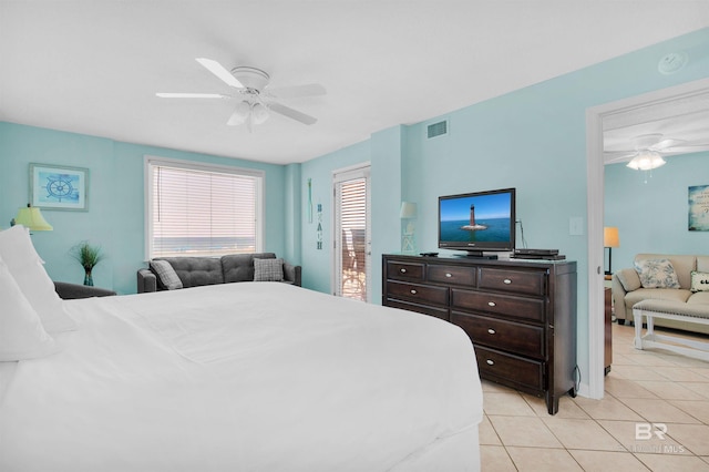 tiled bedroom featuring ceiling fan