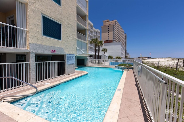 view of pool with pool water feature