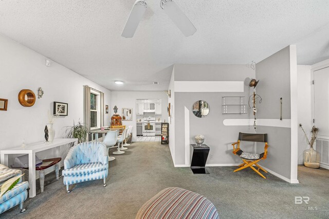 526 W Ariel Ave, Foley, AL 36535 - carpeted living room featuring ceiling fan and a textured ceiling