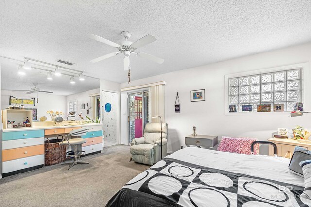 526 W Ariel Ave, Foley, AL 36535 - bedroom featuring light carpet, ceiling fan, a textured ceiling, and access to exterior