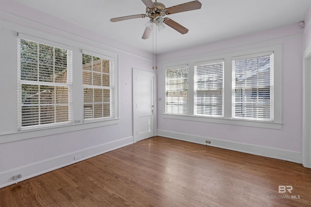 1706 Hunter Ave, Mobile, AL 36604 - empty room featuring healthy amount of natural light, wood finished floors, and a ceiling fan