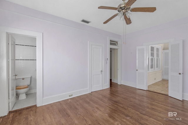 1706 Hunter Ave, Mobile, AL 36604 - unfurnished bedroom featuring wood finished floors and ensuite bathroom