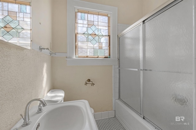 1706 Hunter Ave, Mobile, AL 36604 - full bathroom featuring a sink and combined bath / shower with glass door