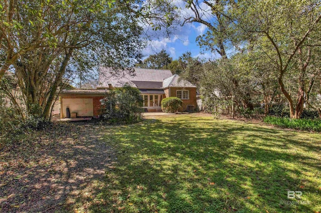 1706 Hunter Ave, Mobile, AL 36604 - view of grassy yard featuring french doors