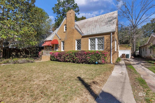 1706 Hunter Ave, Mobile, AL 36604 - view of front of home featuring concrete driveway, a chimney, and brick siding