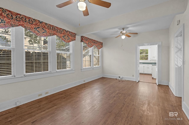 1706 Hunter Ave, Mobile, AL 36604 - unfurnished living room featuring ceiling fan and wood finished floors