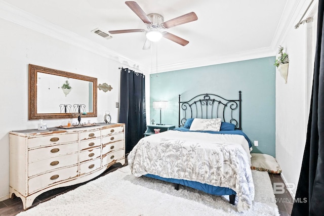 bedroom with ceiling fan, hardwood / wood-style floors, and ornamental molding