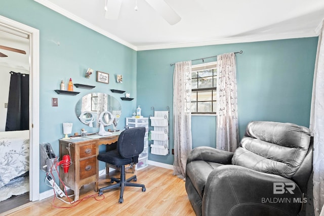 office area with light hardwood / wood-style floors, ceiling fan, and ornamental molding