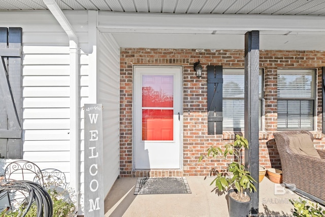 doorway to property with a porch