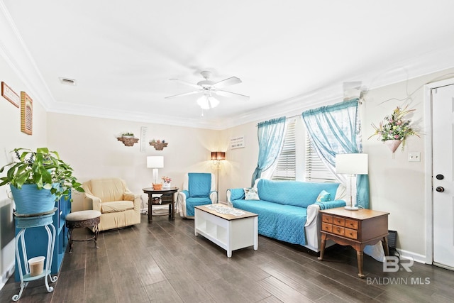 living room featuring dark hardwood / wood-style flooring, ceiling fan, and crown molding