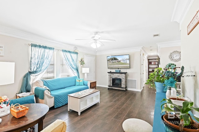 living room featuring dark hardwood / wood-style flooring, a fireplace, and ornamental molding