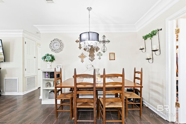 dining room with ornamental molding and an inviting chandelier