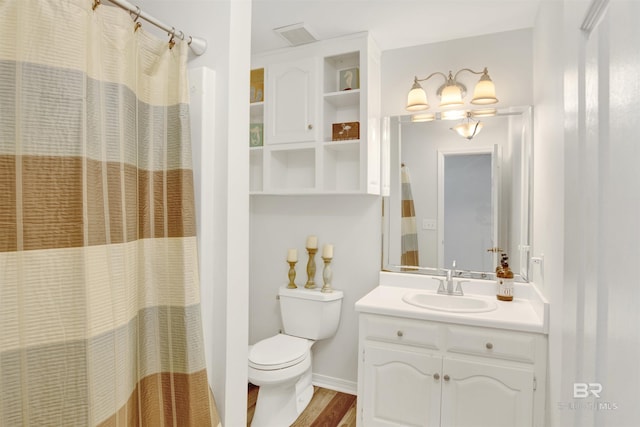 bathroom featuring toilet, visible vents, vanity, baseboards, and a shower with curtain