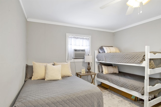 bedroom with ceiling fan, cooling unit, and crown molding