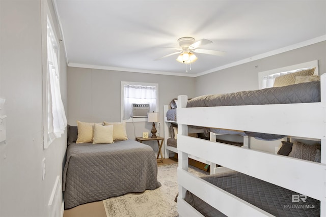 bedroom featuring wood finished floors, cooling unit, a ceiling fan, and crown molding