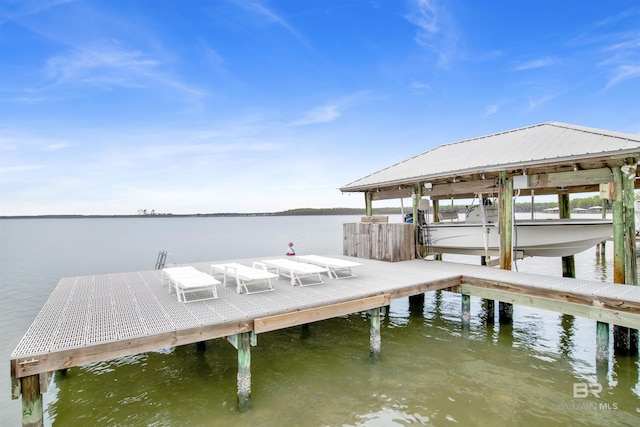 view of dock featuring a water view and boat lift