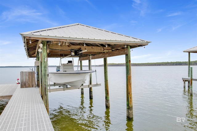 view of dock with a water view and boat lift