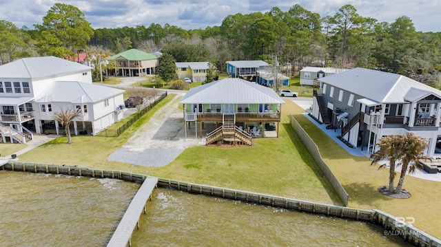 aerial view with a water view and a residential view