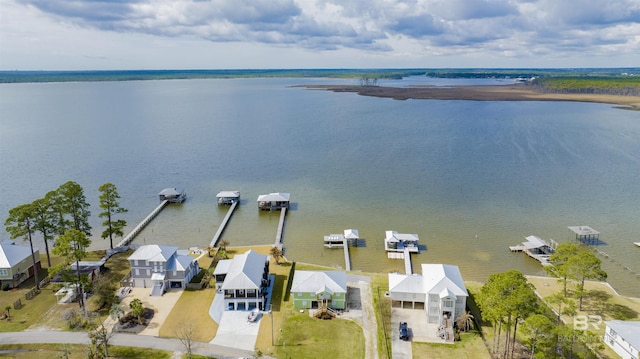 drone / aerial view featuring a water view and a residential view