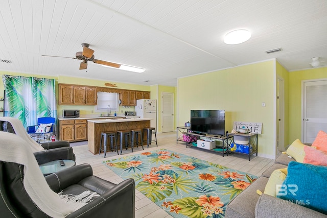 8239 Gulf Beach Ln, Gulf Shores, AL 36542 - living area with a ceiling fan, visible vents, wooden ceiling, and light wood finished floors