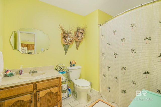8239 Gulf Beach Ln, Gulf Shores, AL 36542 - full bathroom featuring toilet, tile patterned flooring, and vanity