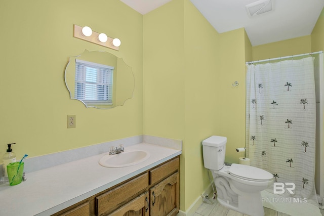 8239 Gulf Beach Ln, Gulf Shores, AL 36542 - bathroom with vanity, a shower with curtain, toilet, and visible vents