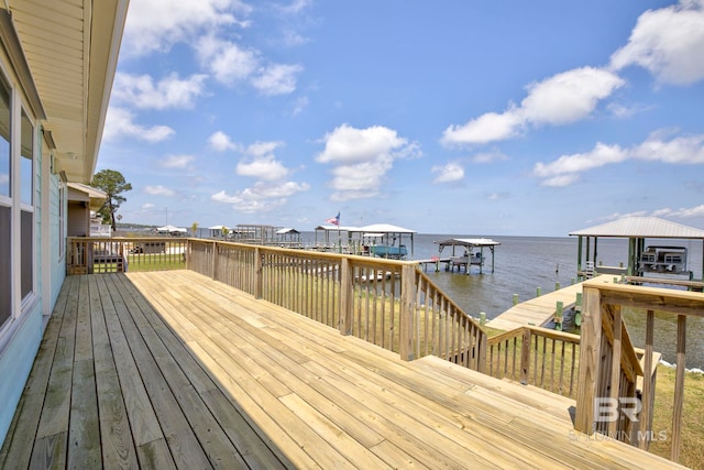 8239 Gulf Beach Ln, Gulf Shores, AL 36542 - wooden deck featuring a boat dock, a water view, and boat lift
