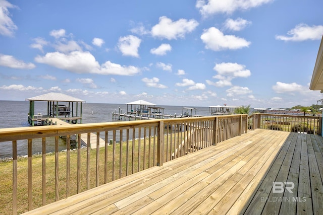 8239 Gulf Beach Ln, Gulf Shores, AL 36542 - deck featuring boat lift, a water view, and a dock