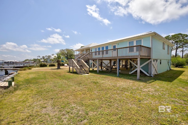 8239 Gulf Beach Ln, Gulf Shores, AL 36542 - back of house with stairway, a lawn, and a deck with water view