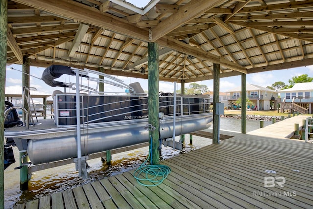 8239 Gulf Beach Ln, Gulf Shores, AL 36542 - dock area featuring boat lift and a residential view