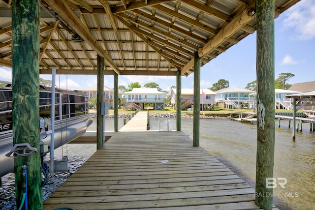 8239 Gulf Beach Ln, Gulf Shores, AL 36542 - view of dock with a residential view, boat lift, and a water view