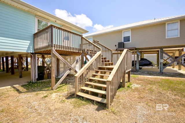 8239 Gulf Beach Ln, Gulf Shores, AL 36542 - wooden terrace featuring stairway and cooling unit