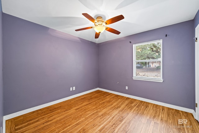 unfurnished room with ceiling fan and light wood-type flooring