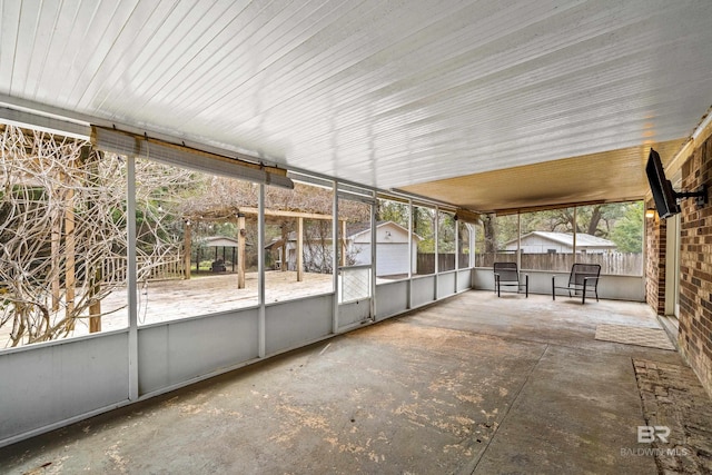 unfurnished sunroom featuring a healthy amount of sunlight