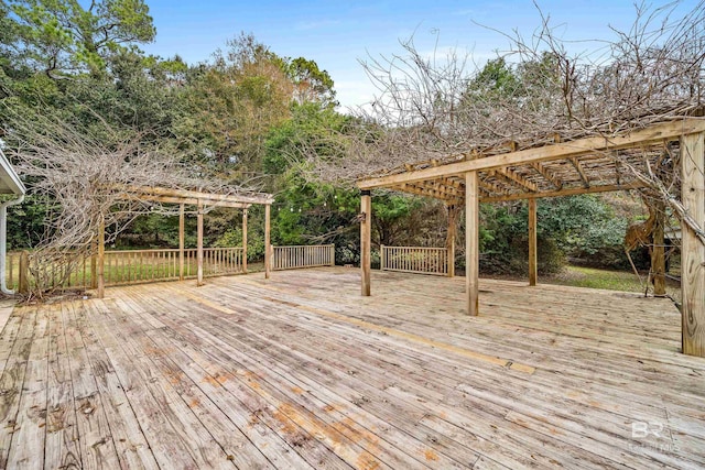 wooden deck featuring a pergola