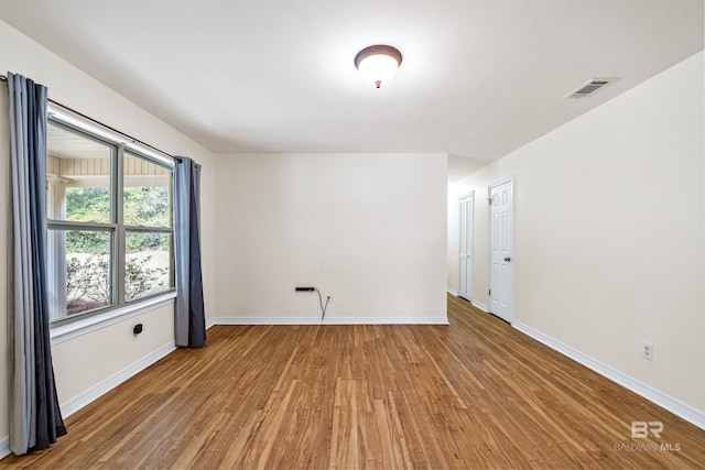 unfurnished room featuring light wood-type flooring