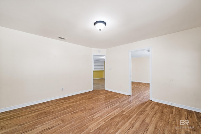 unfurnished room featuring hardwood / wood-style flooring