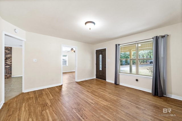 entryway with hardwood / wood-style floors and ceiling fan