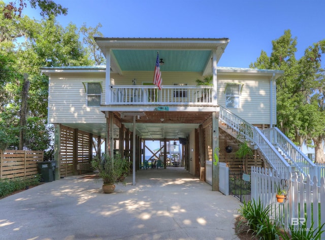 view of front of house featuring a carport and a porch