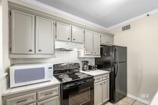 kitchen with light tile patterned floors, crown molding, black appliances, a textured ceiling, and decorative backsplash