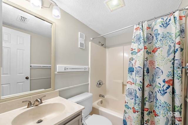 full bathroom with vanity, shower / bath combo with shower curtain, a textured ceiling, and toilet