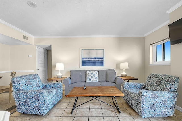 tiled living room featuring ornamental molding and a textured ceiling