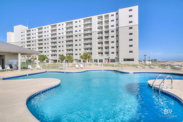 view of swimming pool with a patio