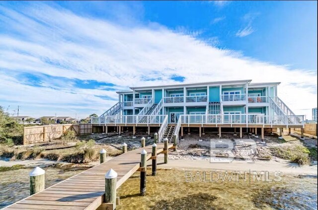 rear view of house with a water view