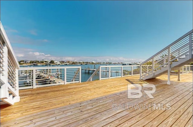 wooden deck featuring a water view