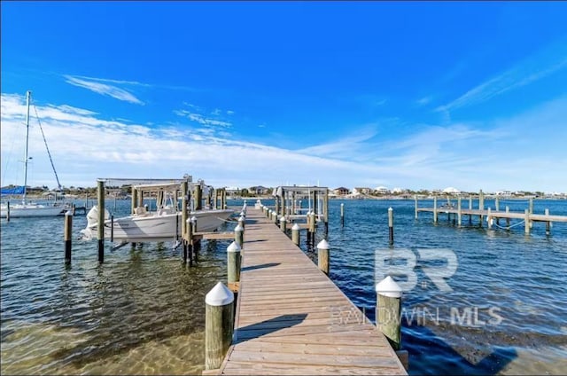 view of dock featuring a water view and boat lift